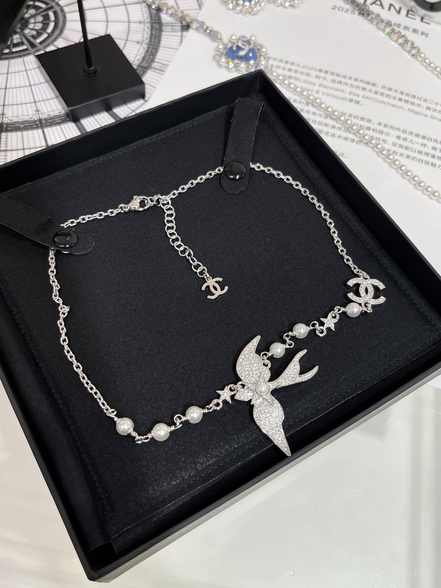 CHANEL 25S New Silver Bird-Inspired Double C Pearl Necklace - LuxuryEva