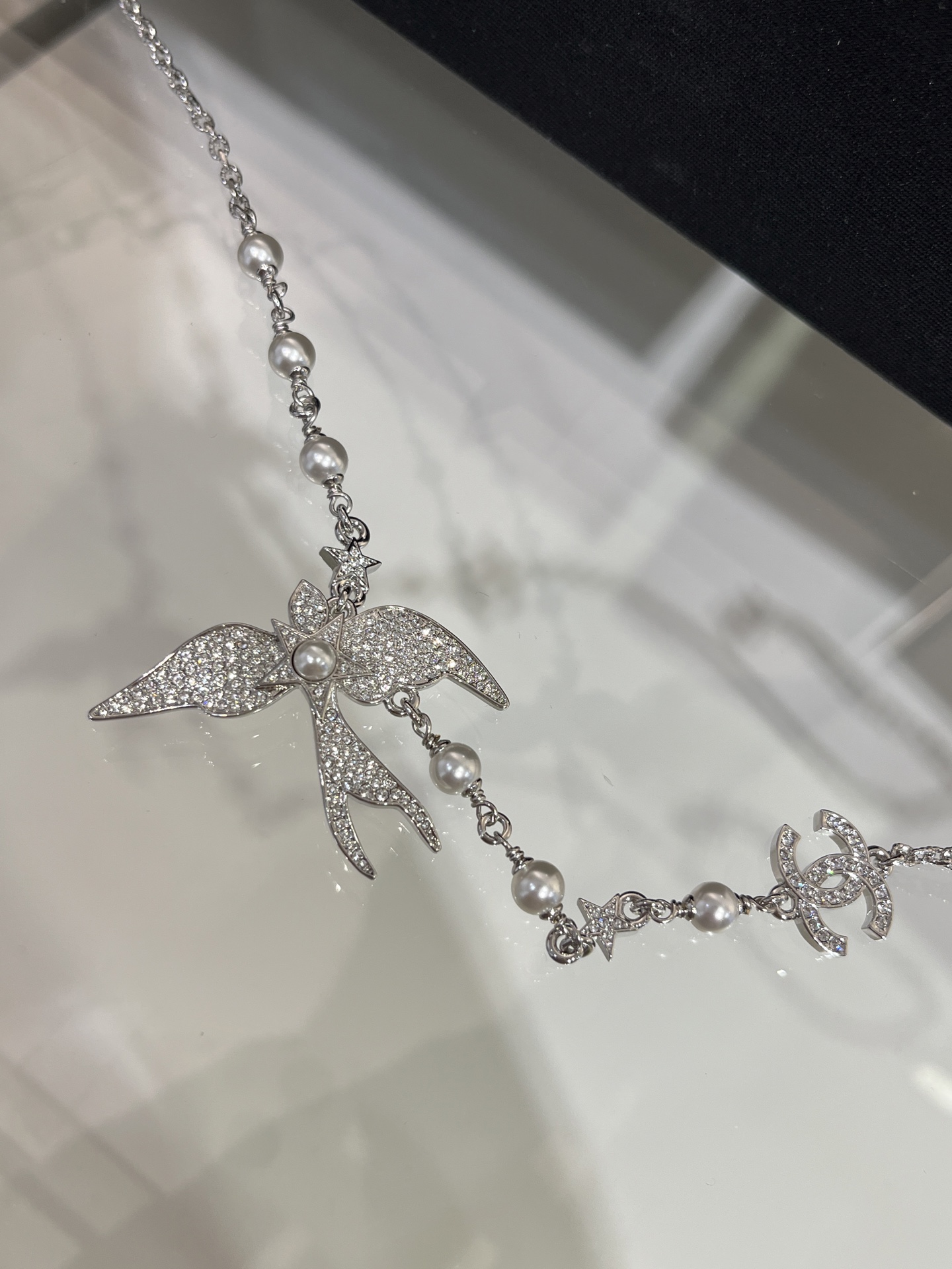 CHANEL 25S New Silver Bird-Inspired Double C Pearl Necklace - LuxuryEva