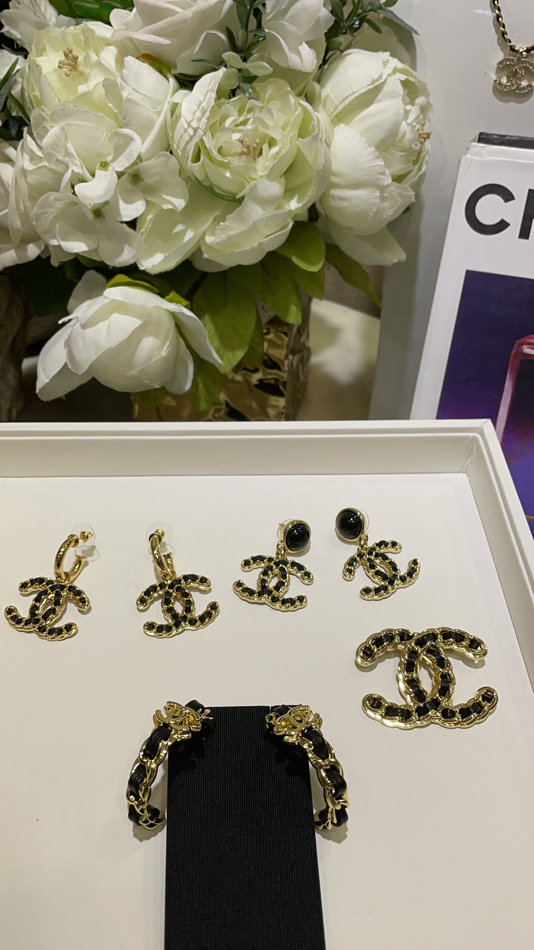 CHANEL 24K New Gold Double C Hoop Earrings with Leather-Woven Chain - LuxuryEva