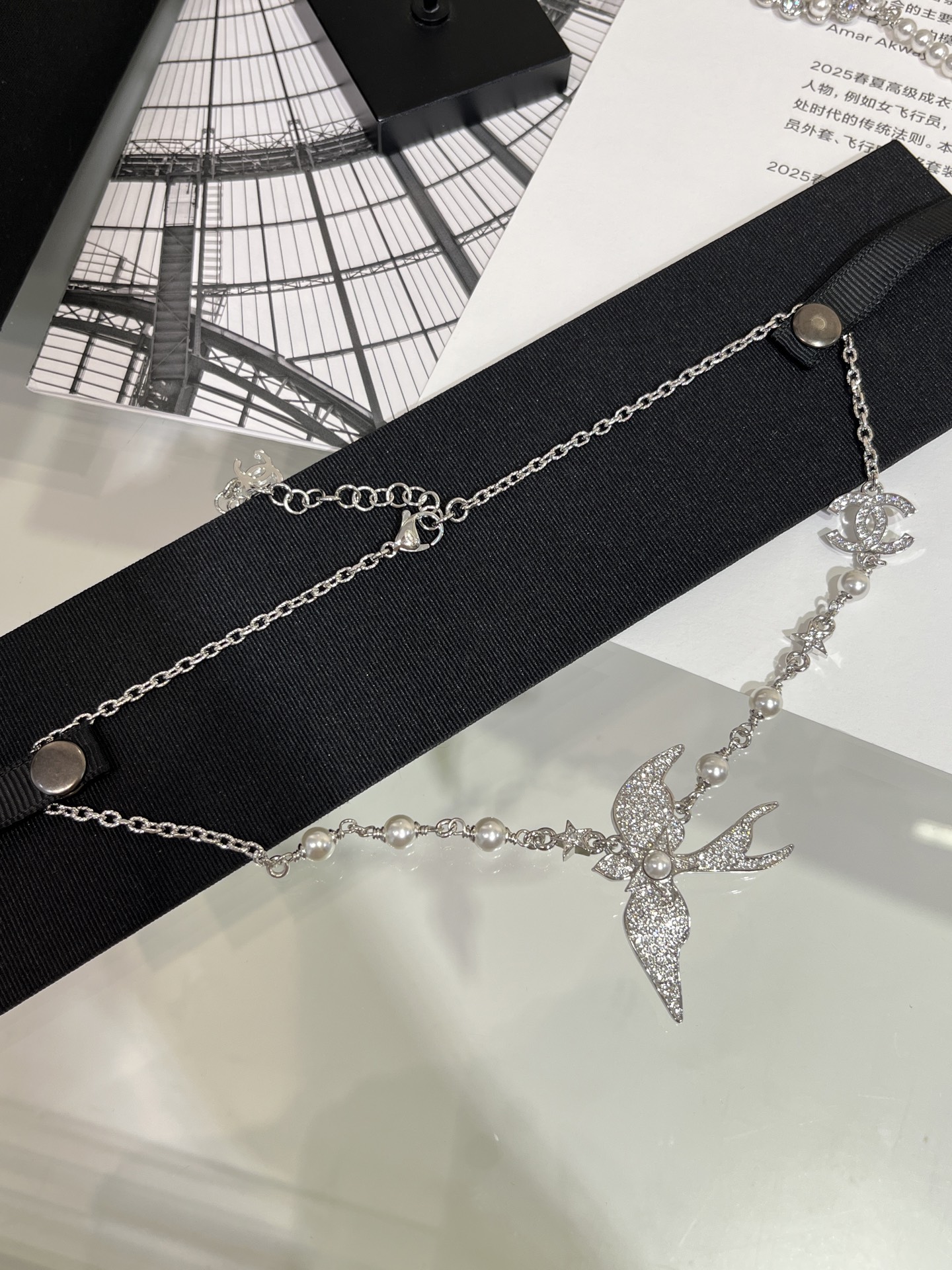 CHANEL 25S New Silver Bird-Inspired Double C Pearl Necklace - LuxuryEva