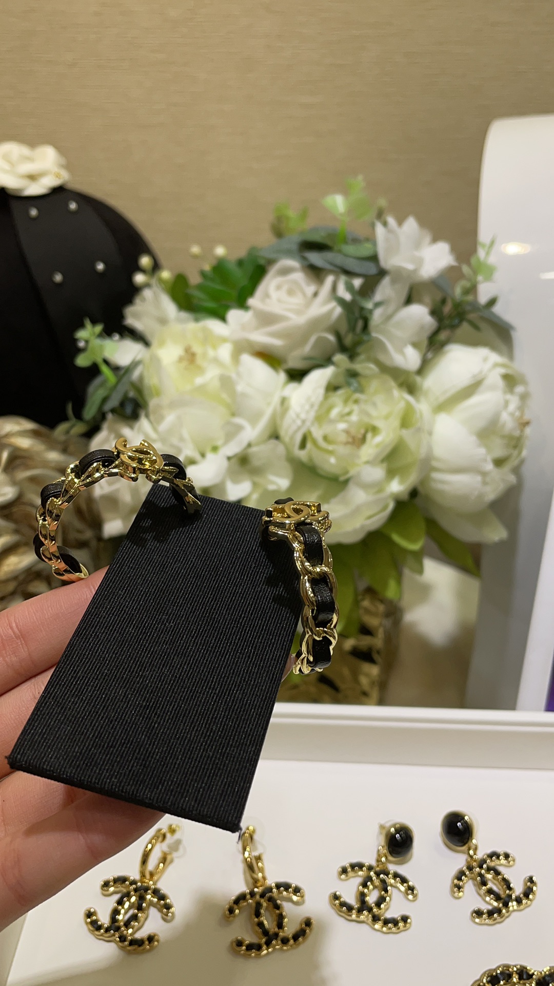 CHANEL 24K New Gold Double C Hoop Earrings with Leather-Woven Chain - LuxuryEva