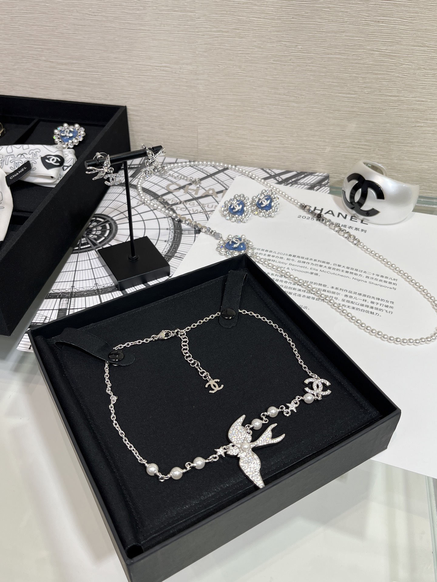 CHANEL 25S New Silver Bird-Inspired Double C Pearl Necklace - LuxuryEva